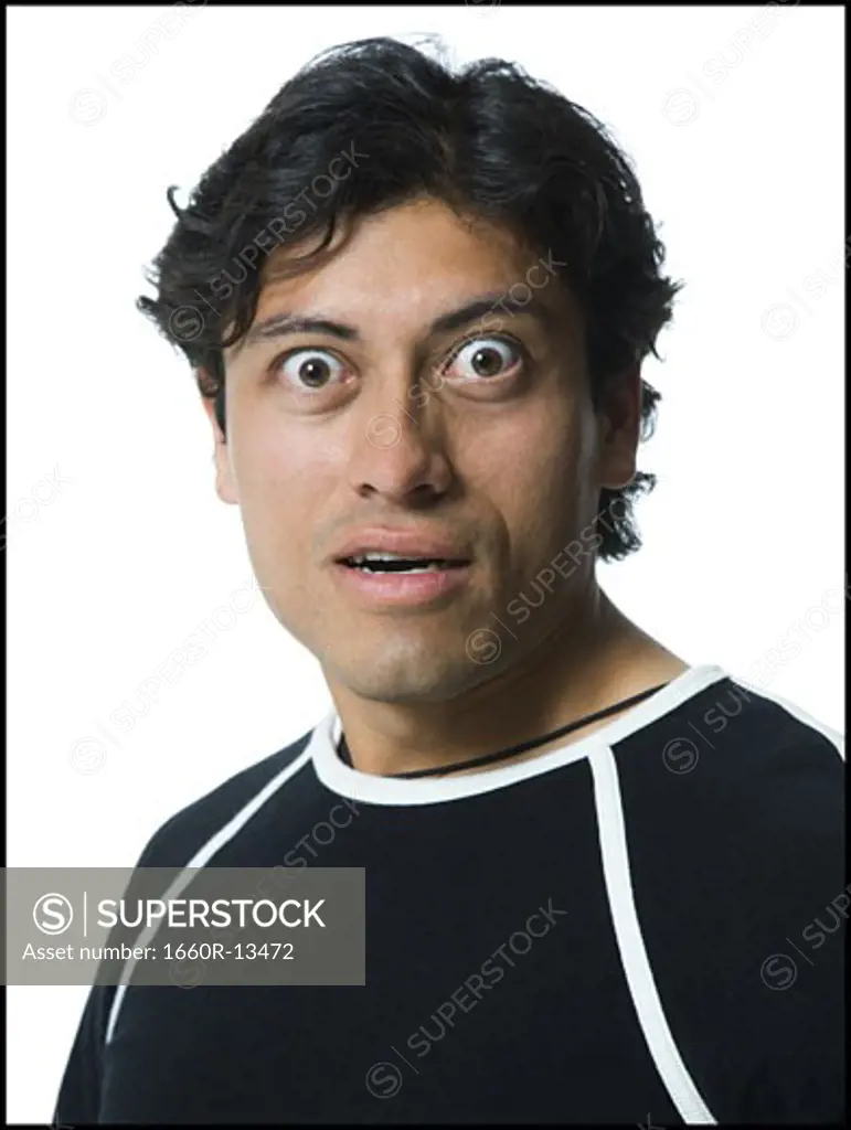 Portrait of a young man looking surprised