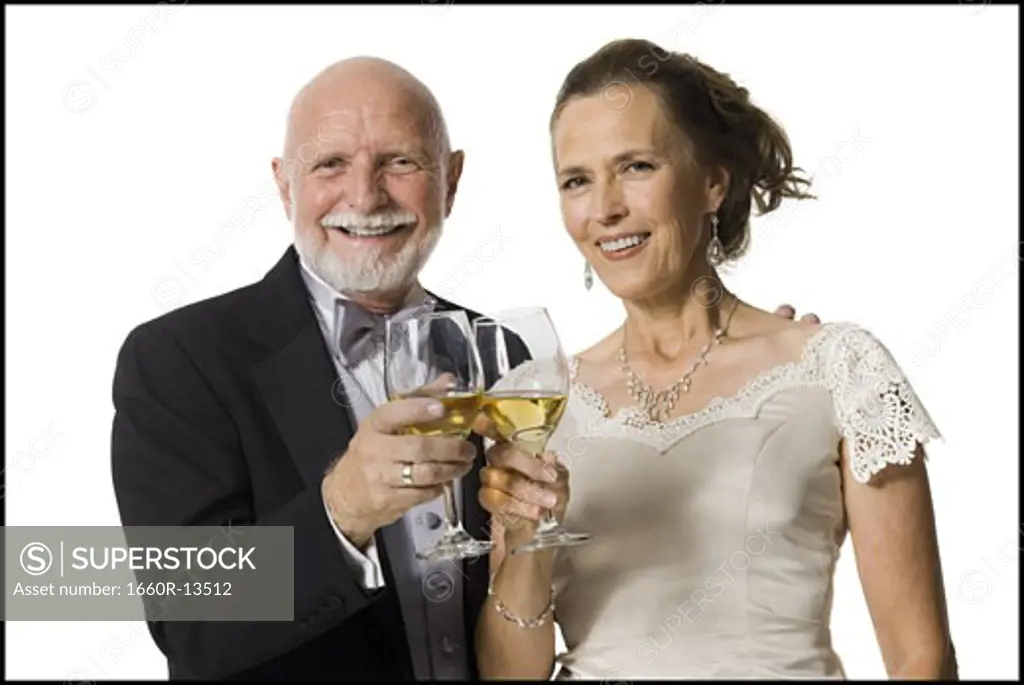 Portrait of a senior couple toasting with wine glasses