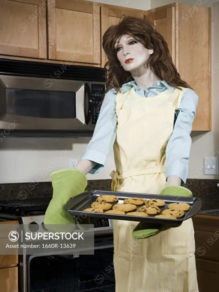 Mannequin portraying a woman holding a tray of biscuits