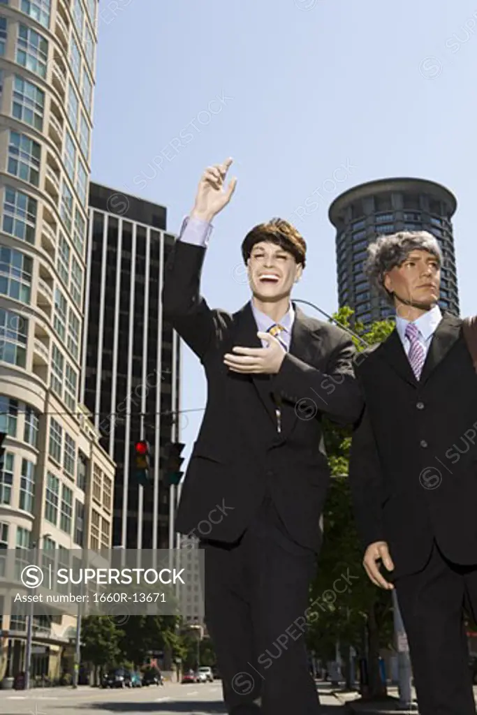 Two mannequins portraying businessmen