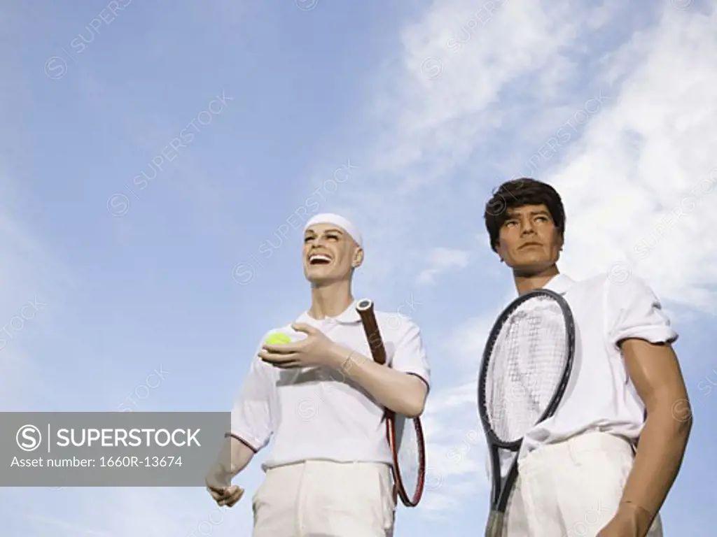 Low angle view of two mannequins portraying tennis players