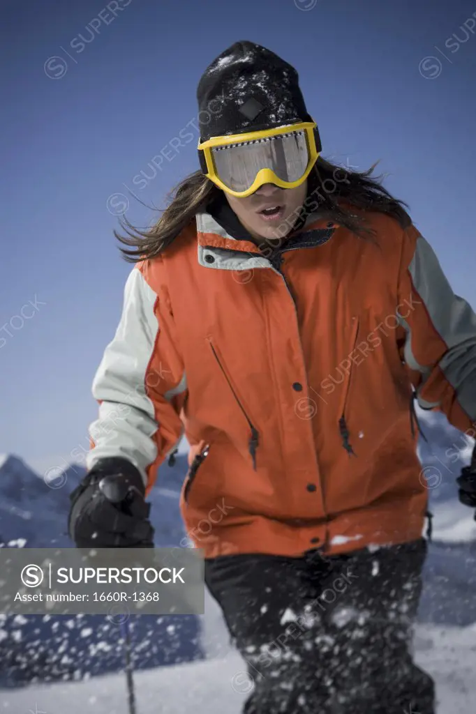 Mid adult woman skiing