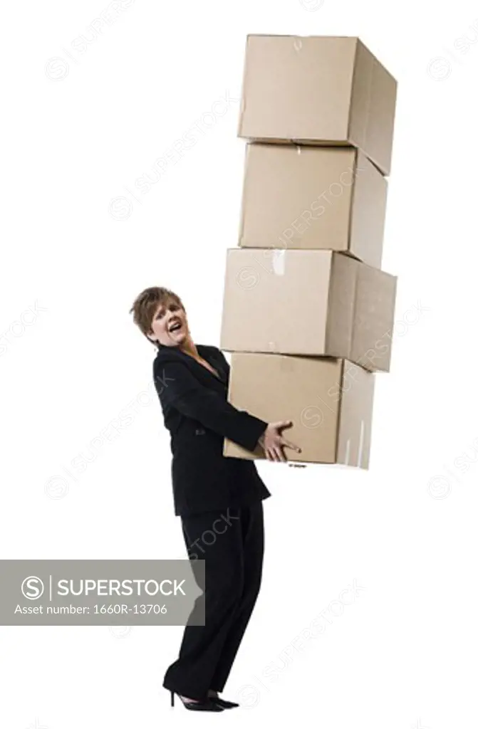 Profile of a senior woman holding a stack of cardboard boxes