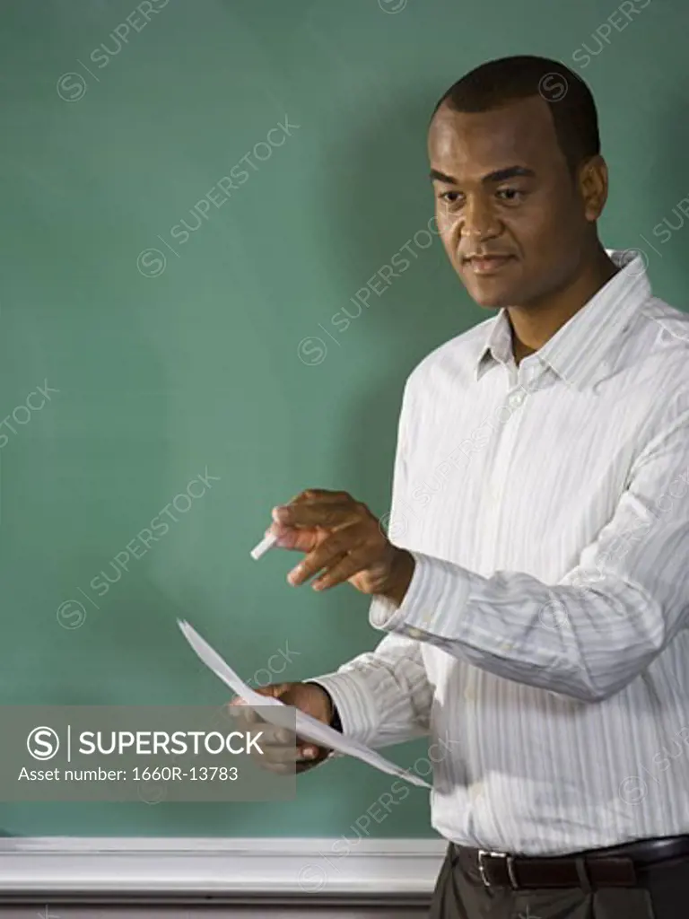 College teacher giving a lesson in classroom
