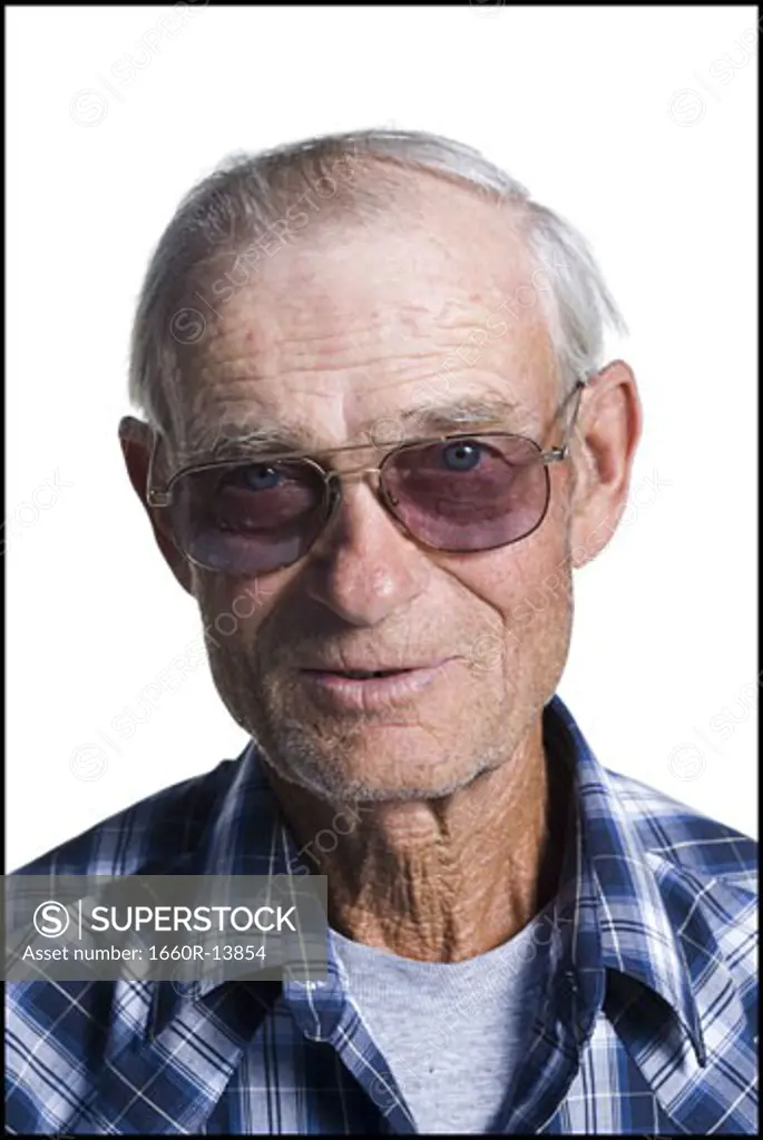 Older man in plaid shirt wearing sunglasses