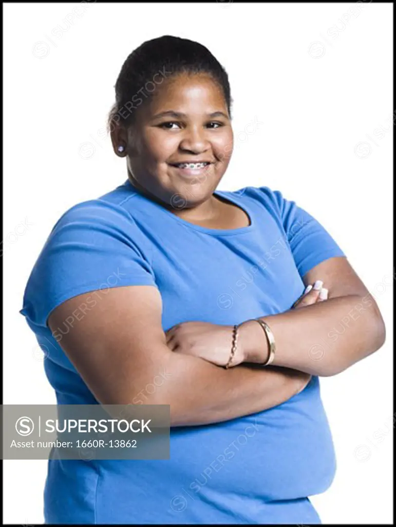 Heavyset young woman with arms folded