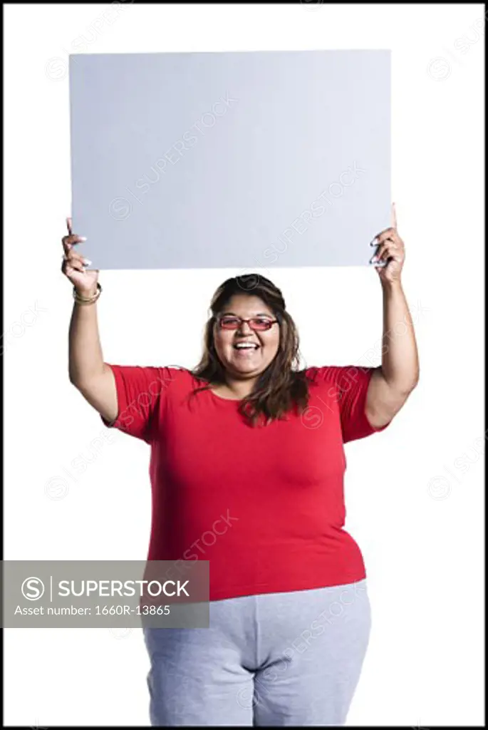 Heavyset young woman holding blank sign