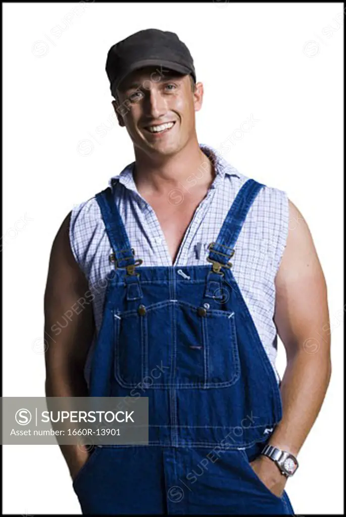 Farmer wearing a ball cap with hands in pockets