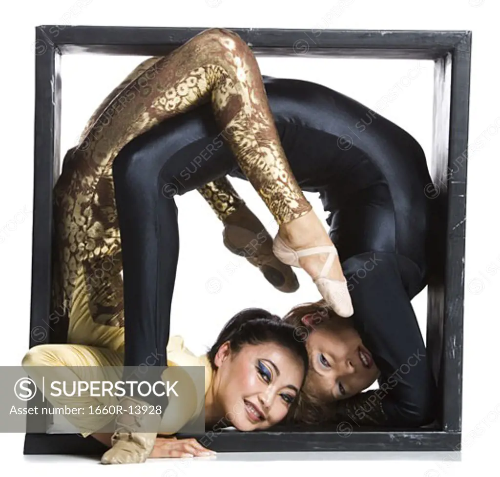 Female contortionist duo inside the box