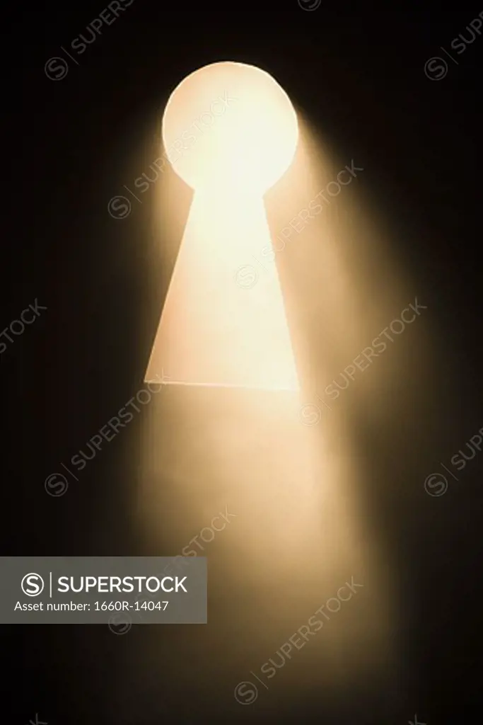 Keyhole with bright light beaming through
