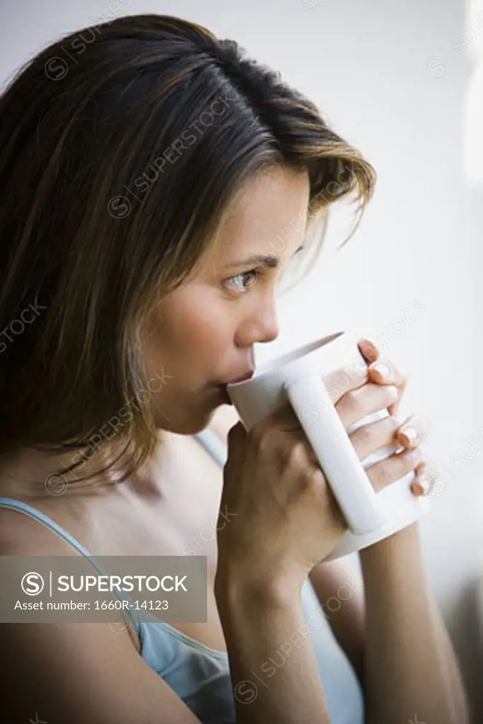 Woman enjoying a mug of coffee