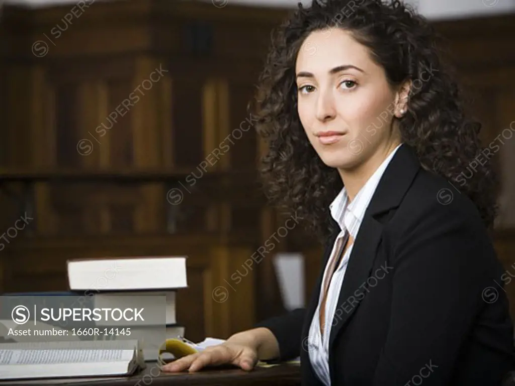 Female lawyer smiling in courtroom