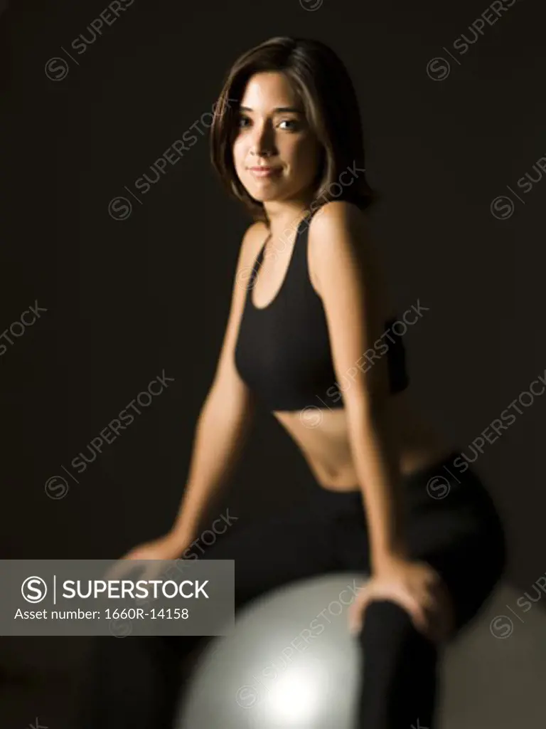 Woman performing Pilates exercises