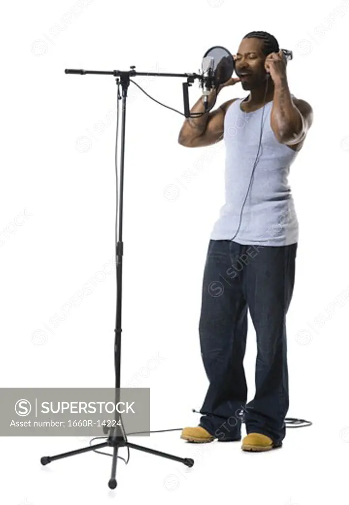 African American man singing into microphone