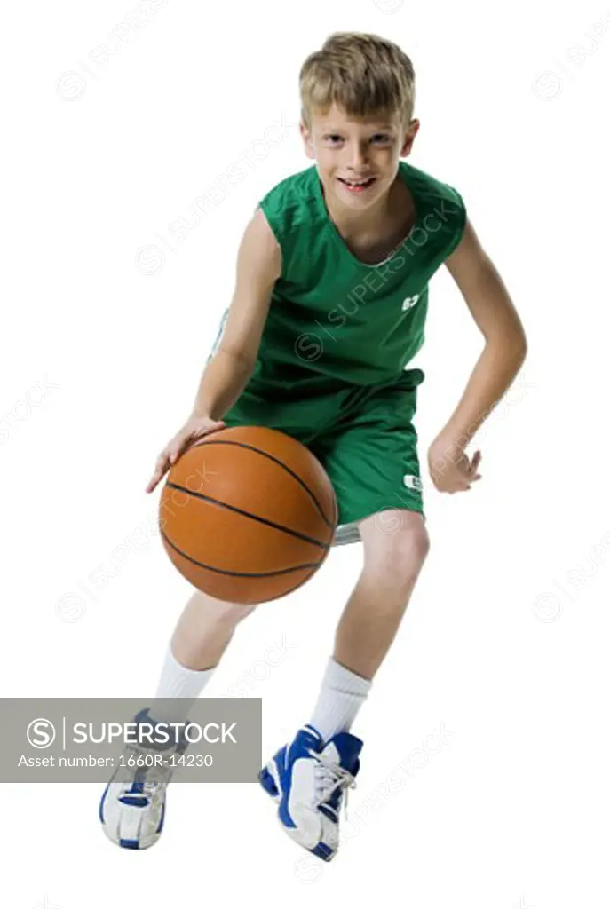 Young boy playing basketball