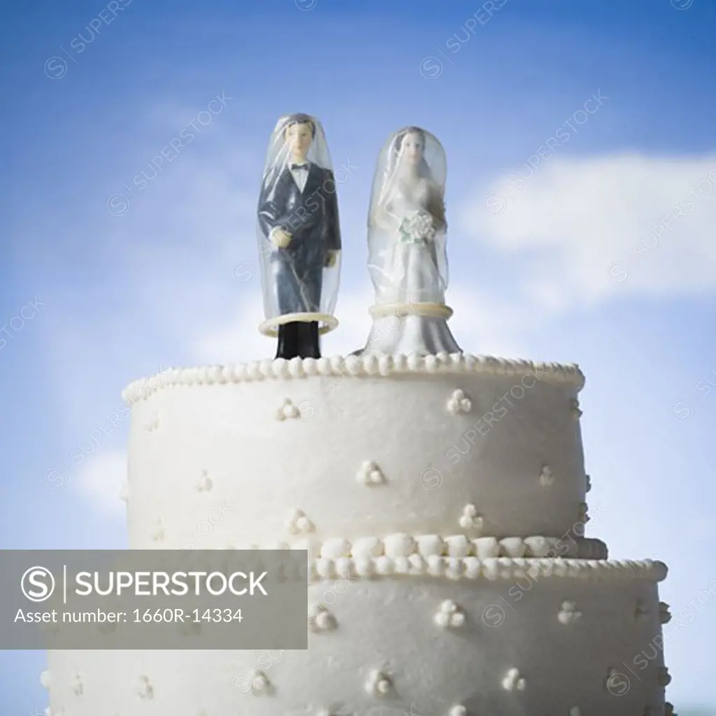 Wedding cake visual metaphor with figurine cake toppers