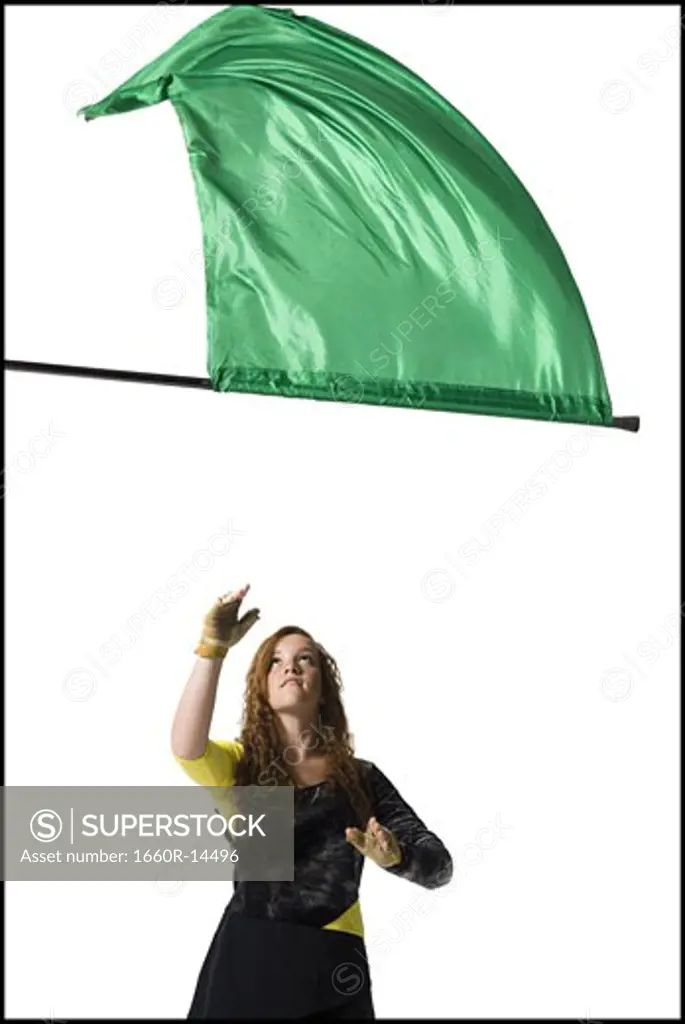 Female color guard twirling flag
