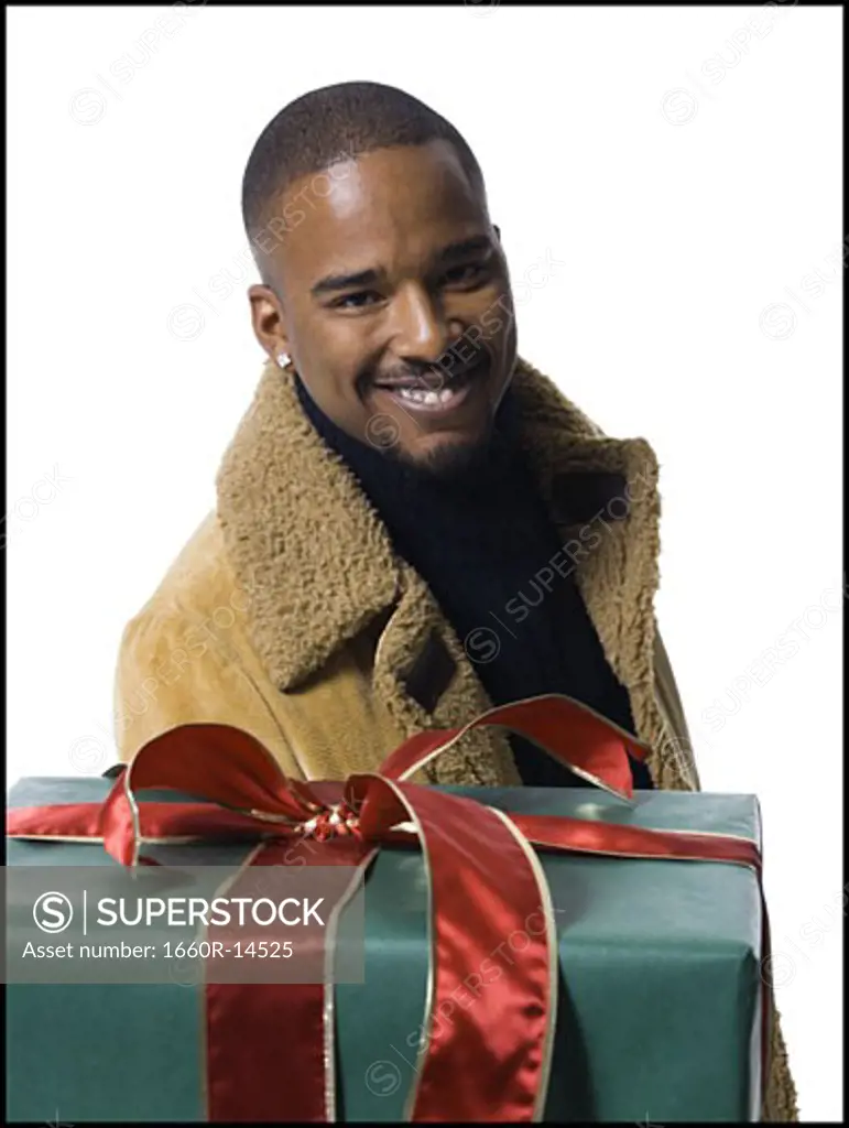 African American man with Christmas gift