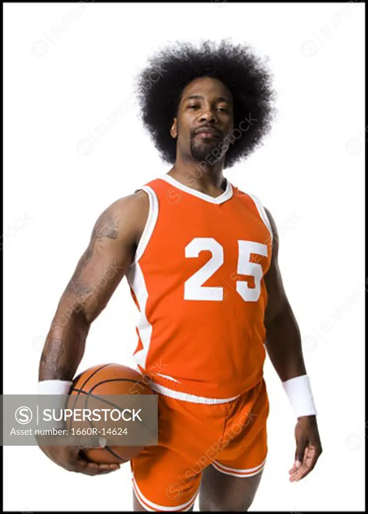 Basketball player with an afro in orange uniform