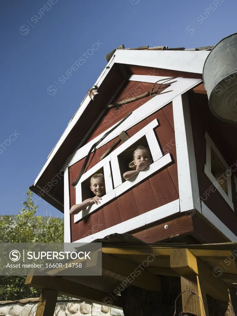 Boy and girl in a playhouse