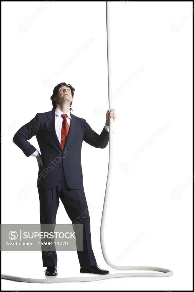 Businessman holding a rope