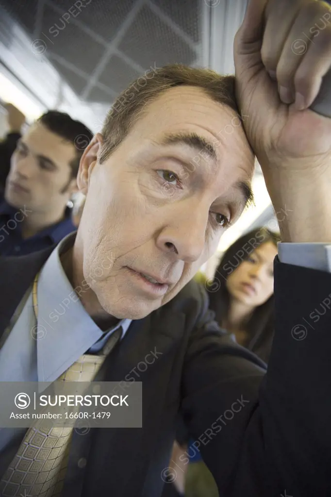 Close-up of a man traveling on a passenger train