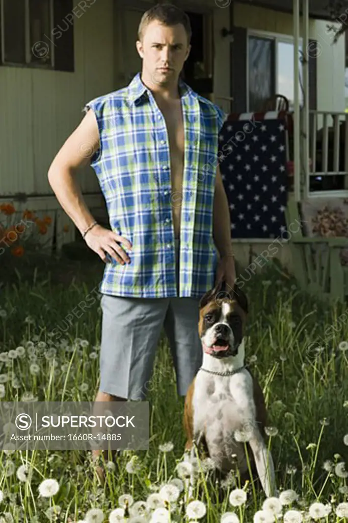 Man in trailer park with dog