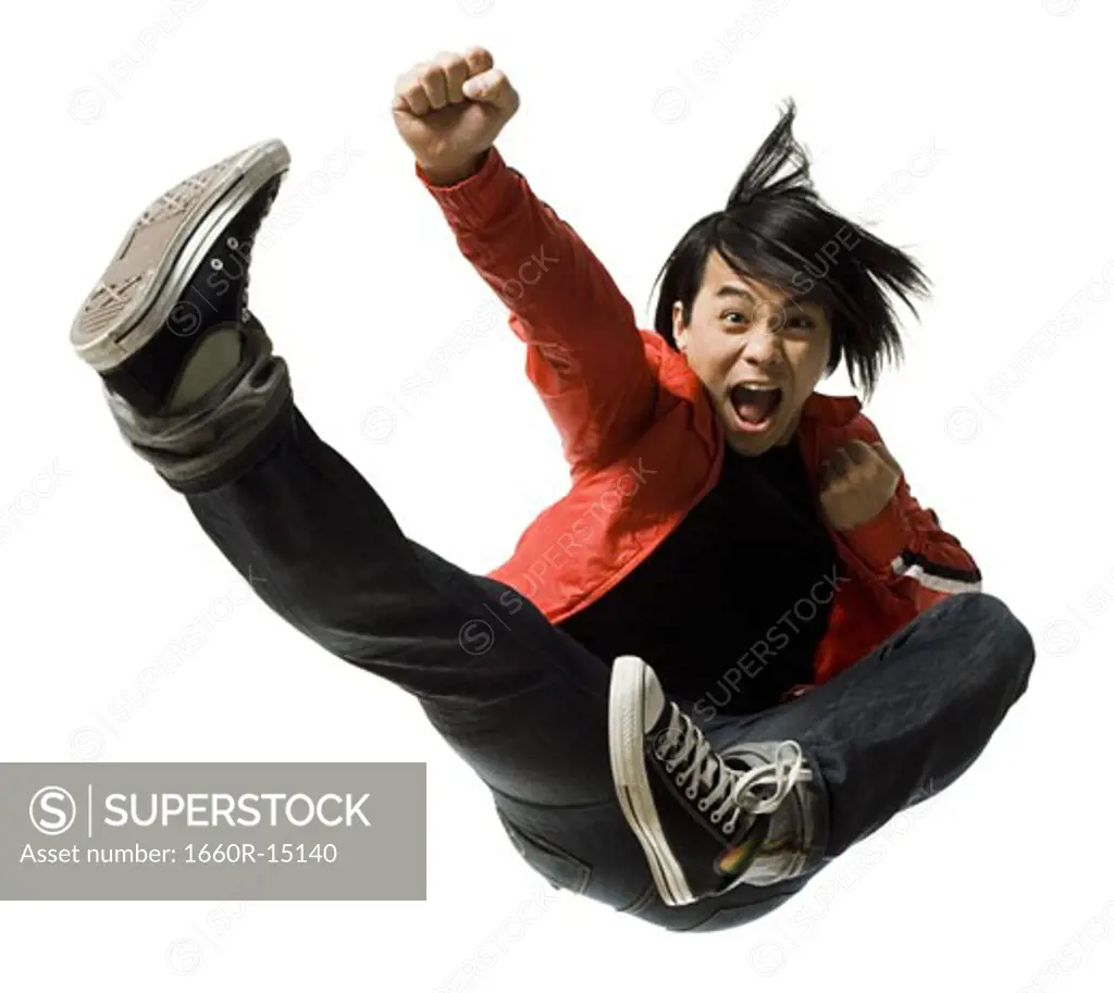 Man leaping and kicking