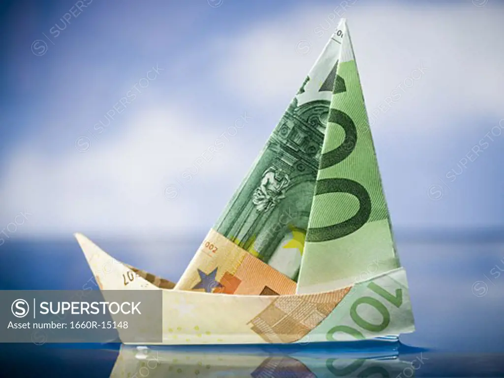 Paper sailboat made of Euro banknotes