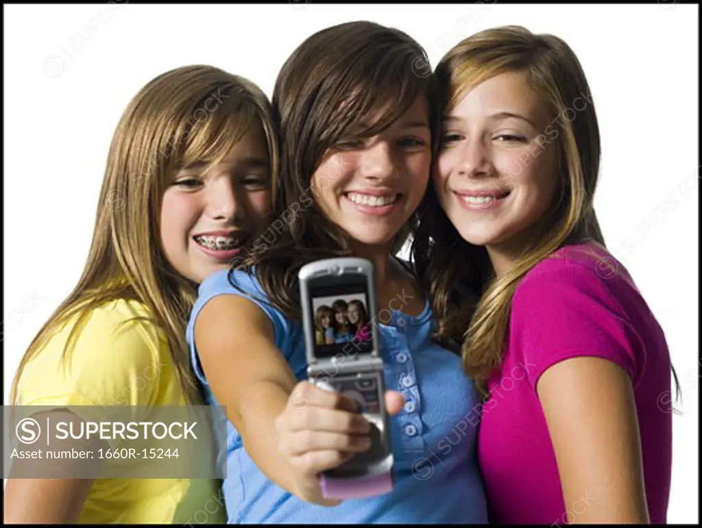 Three girls with camera phone