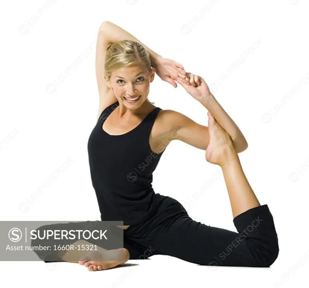 Fit woman stretching and exercising