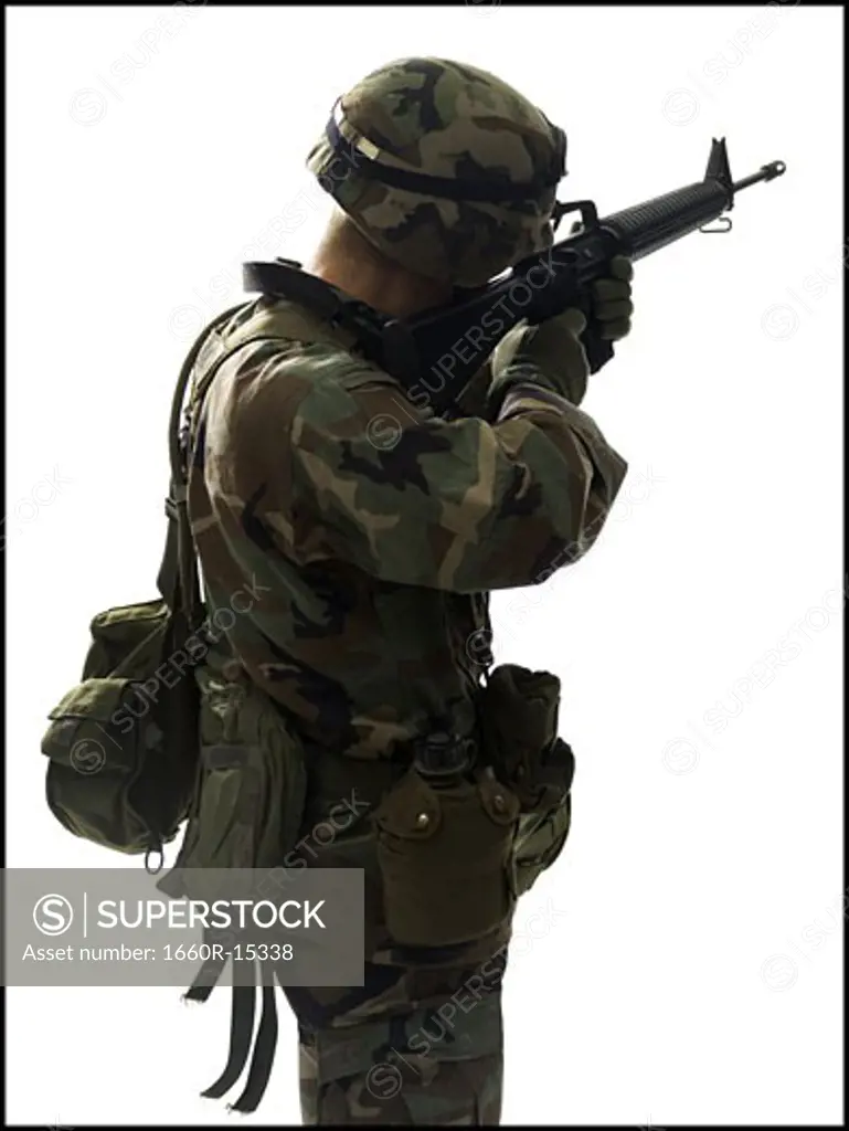US army soldier pointing gun