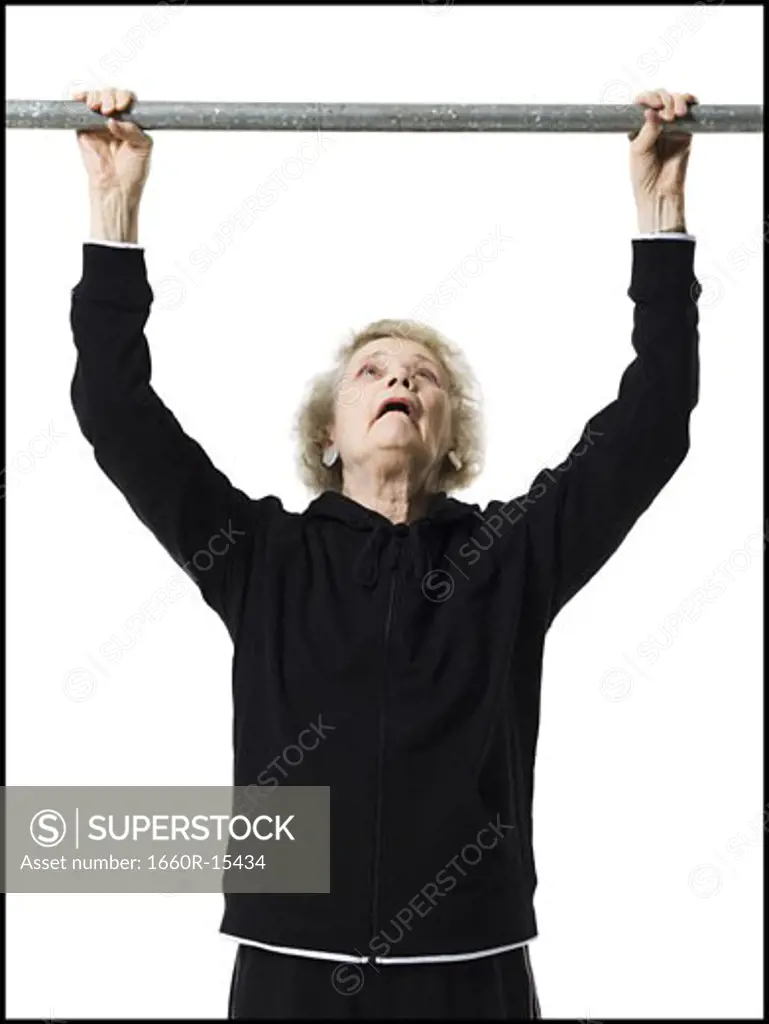 Older woman doing pull up exercises