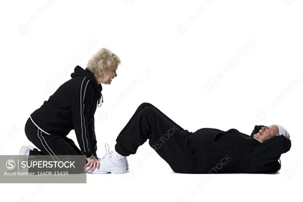 Older man doing sit-up exercises