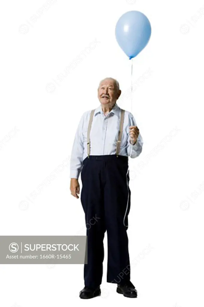 Older man holding balloon