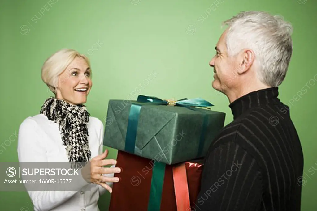 Couple exchanging Christmas presents