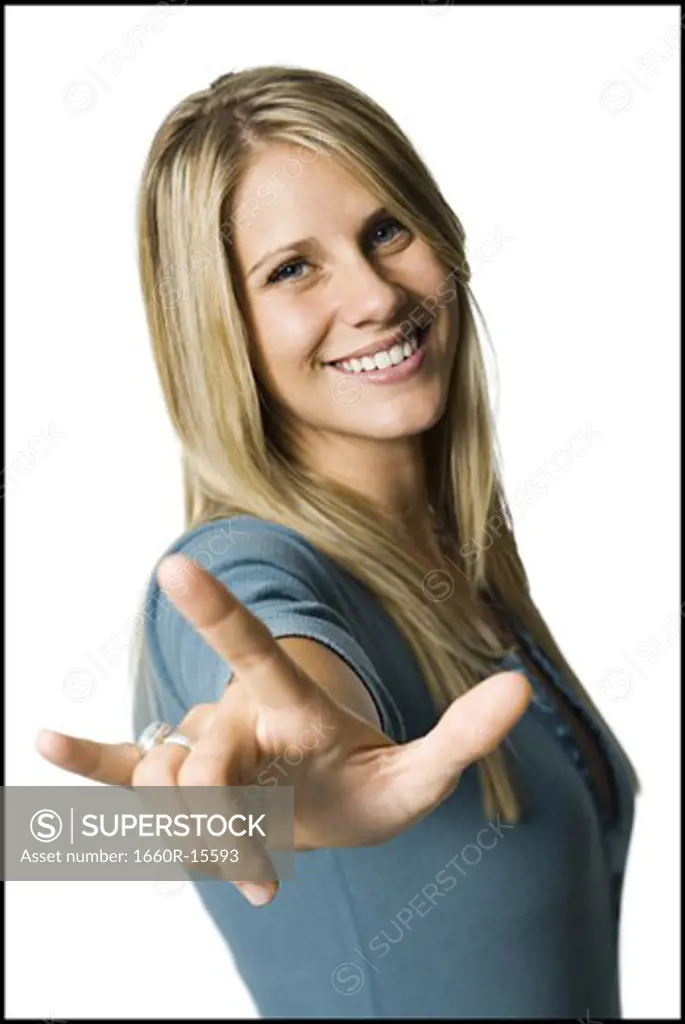 Woman making a hand gesture