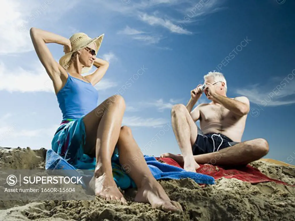 Mature couple relaxing at the beach