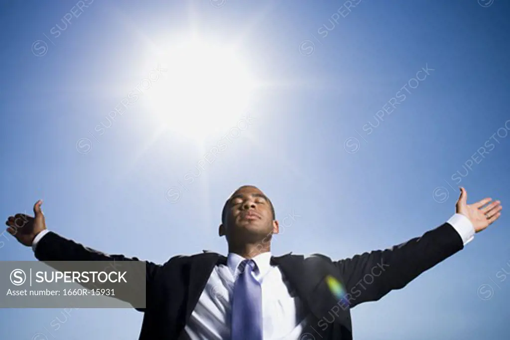 Businessman with outstretched arms