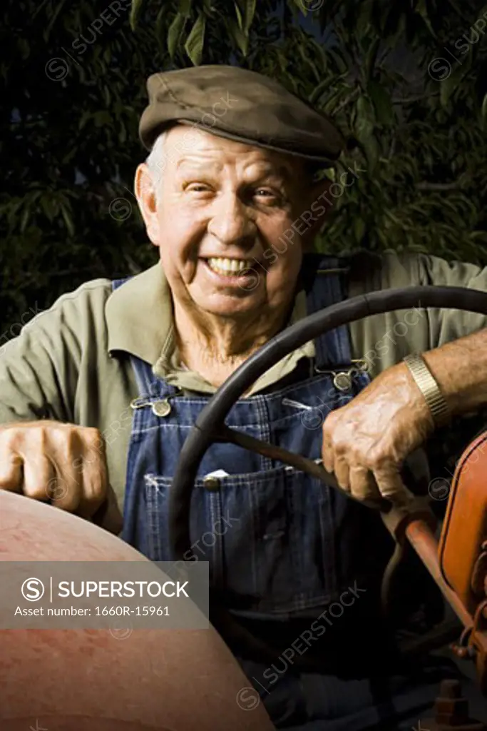Farmer posing with his tractor