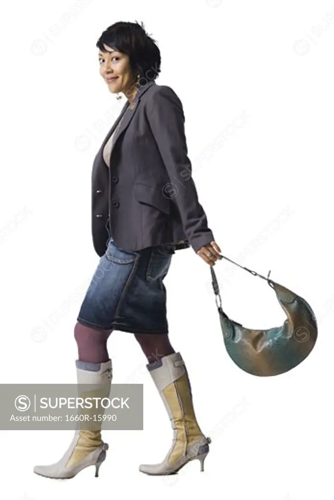 Woman with knee high boots and handbag