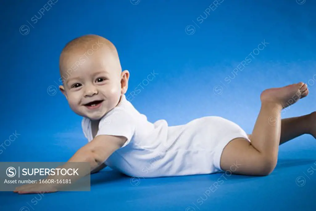 Baby on belly smiling