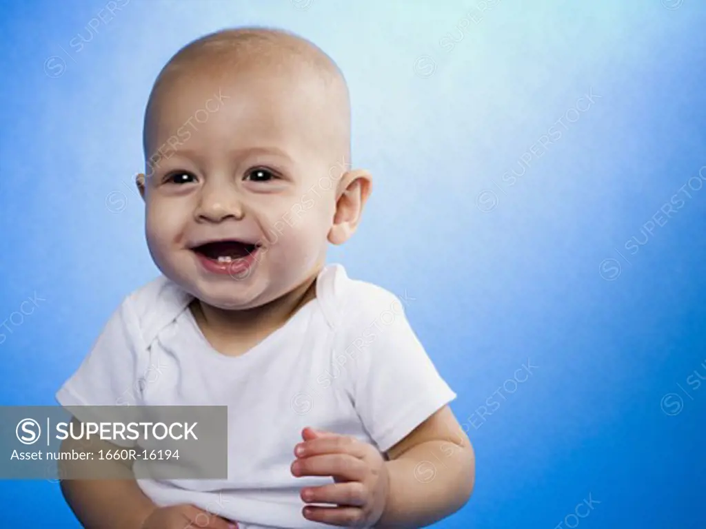 Baby smiling with copy space