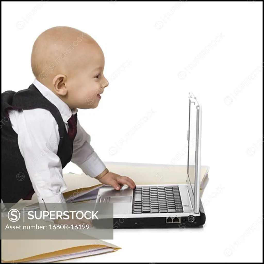 Baby Boy in suit with laptop
