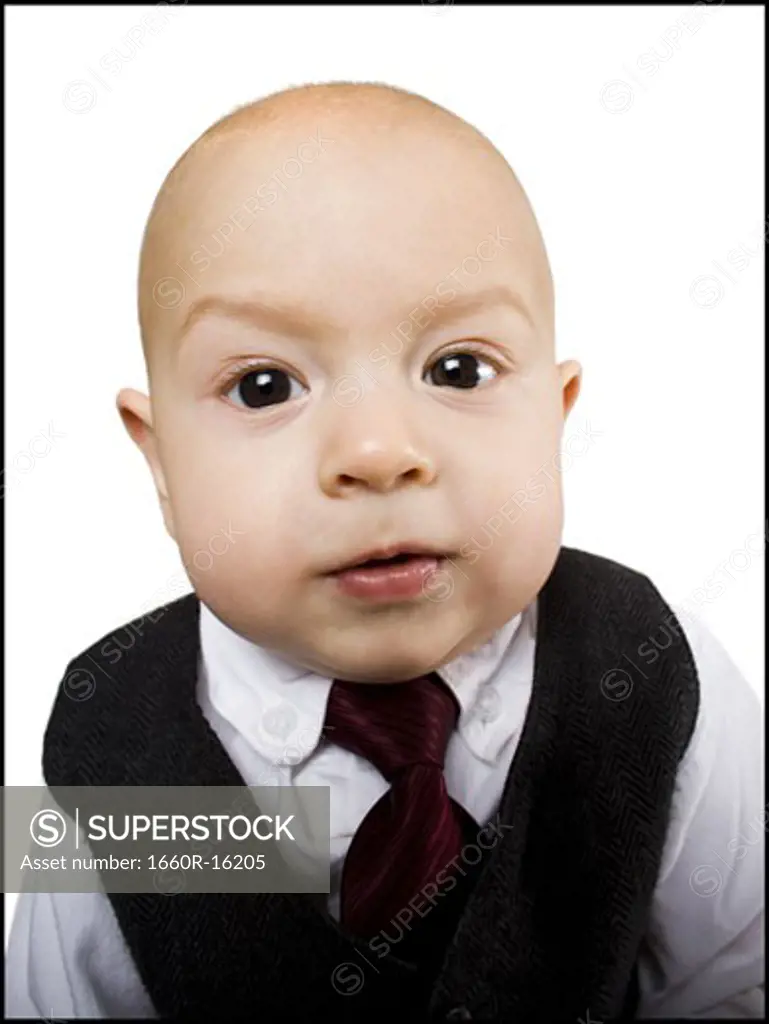 Close-up of baby boy in business suit