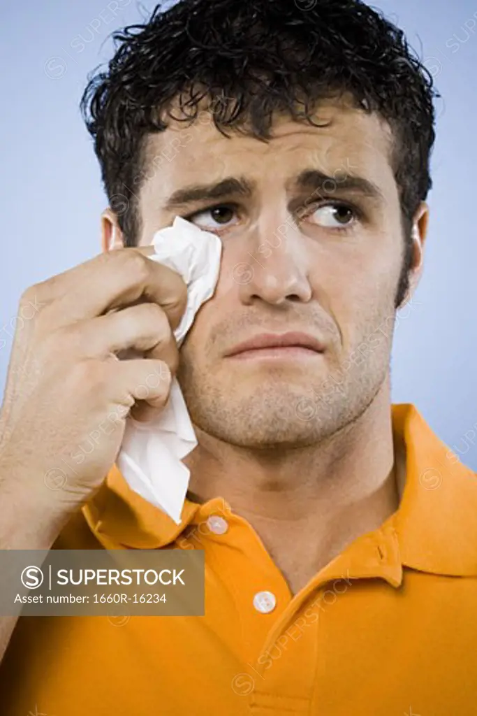 Man crying with tissue