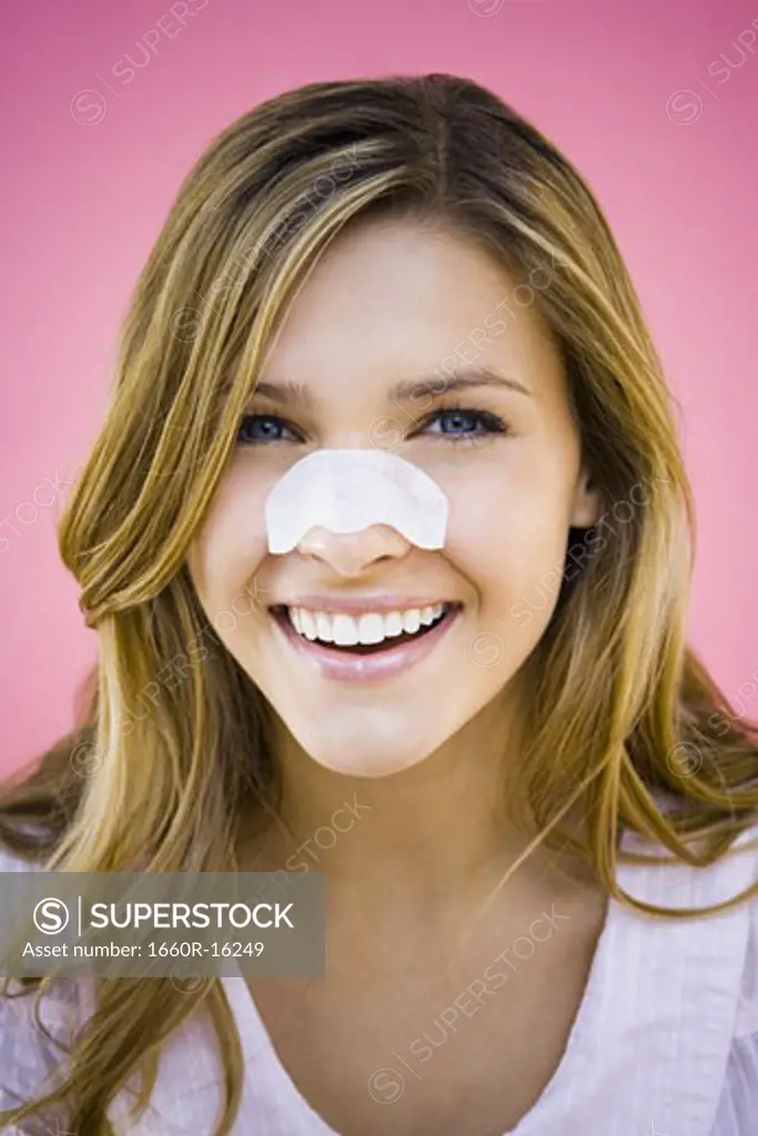 Woman with cleansing strip on nose