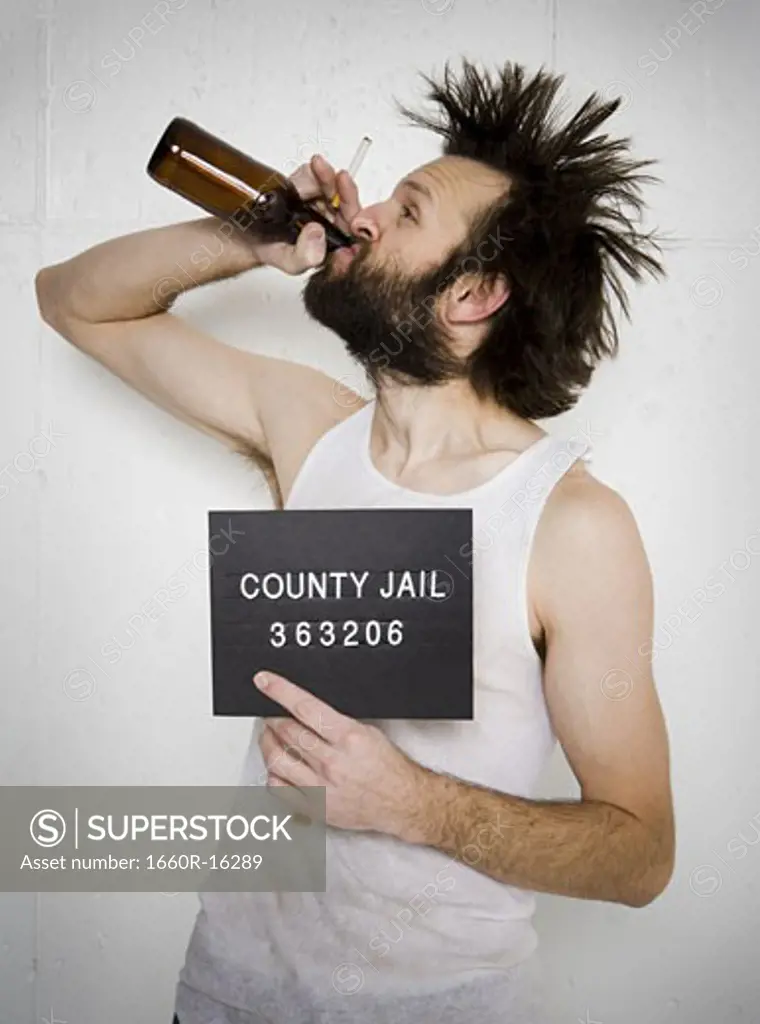 Man drinking beer holding blank sign and cigarette