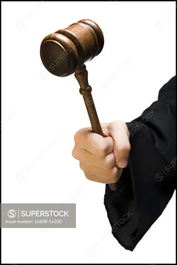 Hand with judge's gavel