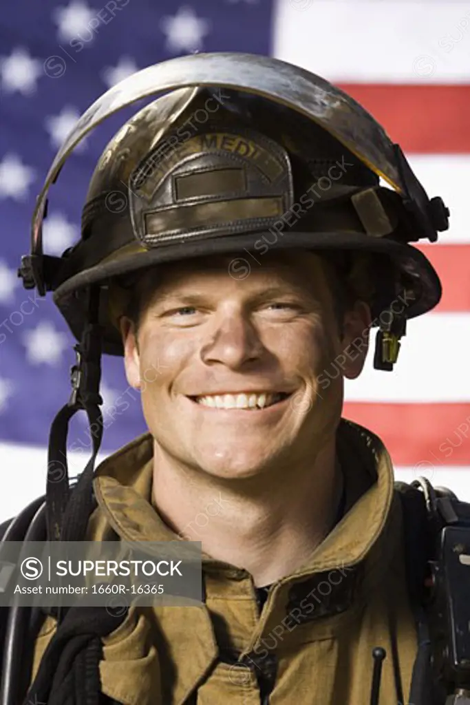 Portrait of a firefighter smiling with US flag